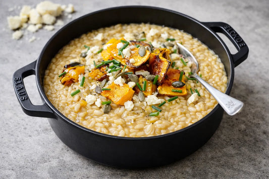 Risotto met pompoencrème, geroosterde pompoen, geitenkaas, rucola en tijm